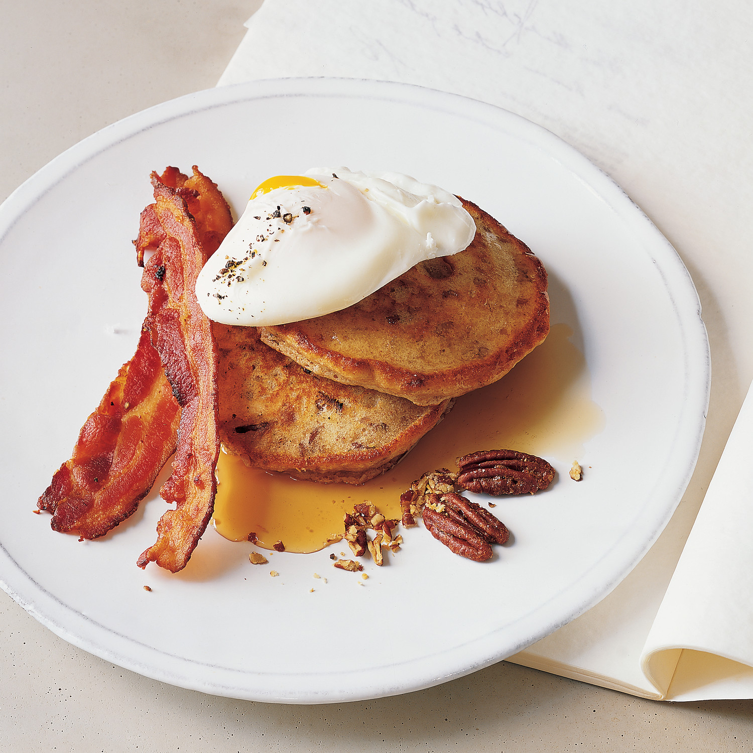 Poached Eggs with Bacon and Toasted Pecan Pancakes Recipe | Martha Stewart