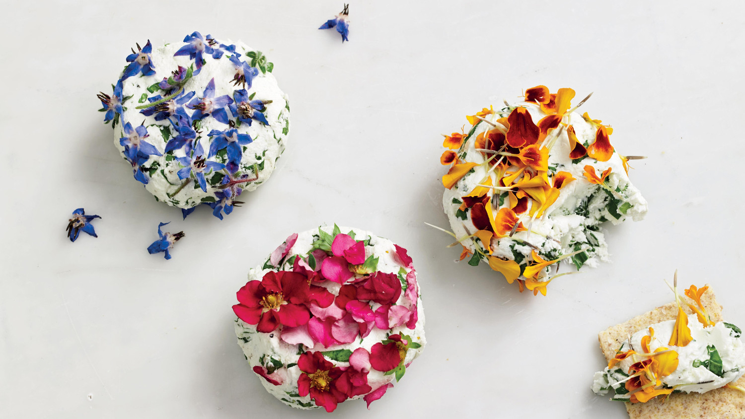goat cheese with edible flowers and arugula paper flower bunch