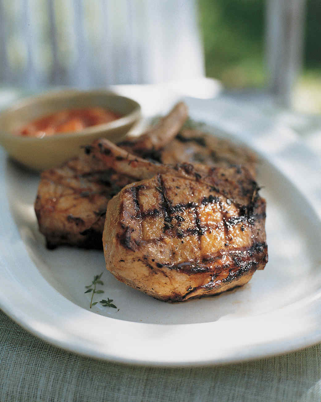 Grilled Pork Chops with PeachTomato Barbecue Sauce Recipe Martha Stewart