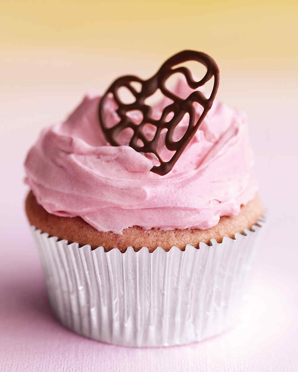 Raspberry Cupcakes with Pink Buttercream and Lacy Chocolate Hearts