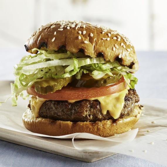 cheeseburger with grilled bun tomatoes pickles lettuce cheeseburger with grilled bun tomatoes pickles lettuce