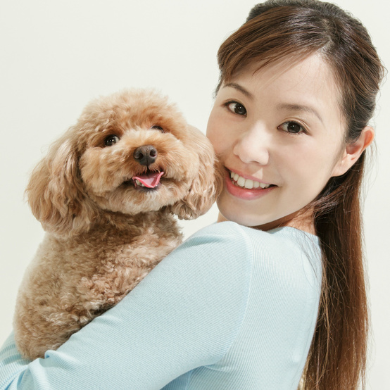happy dog owner and poodle