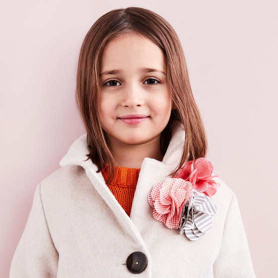 flower pin on little girl's coat