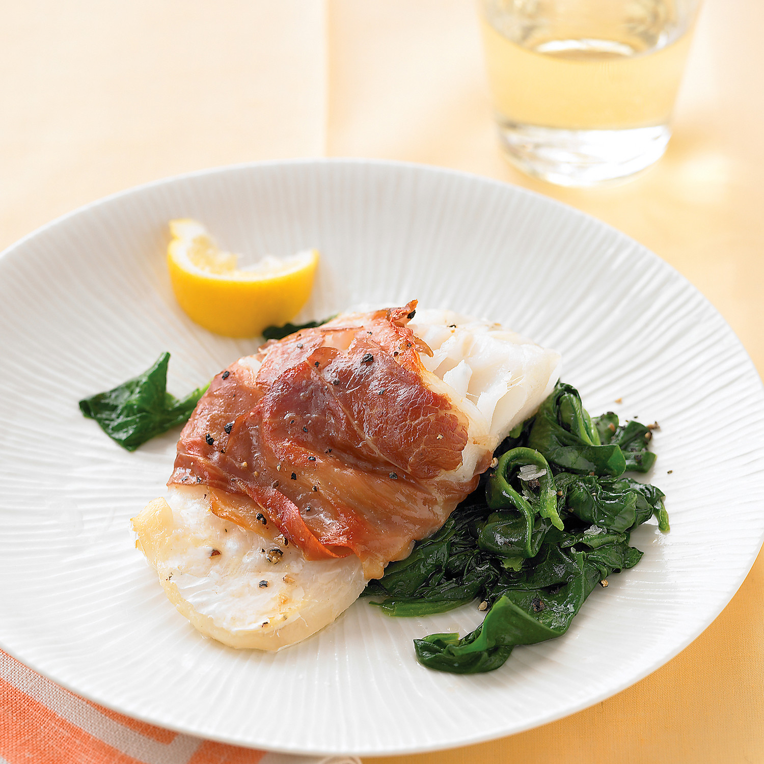 ProsciuttoWrapped Cod with Lemony Spinach