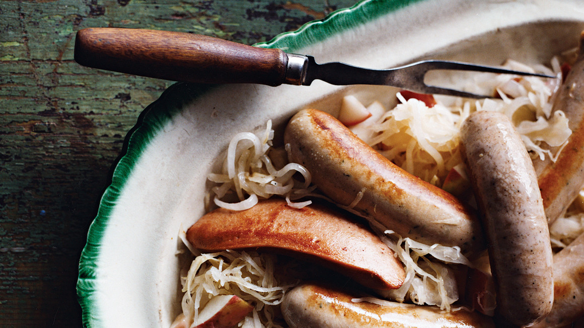 German Sausages With Apples Sauerkraut And Onion