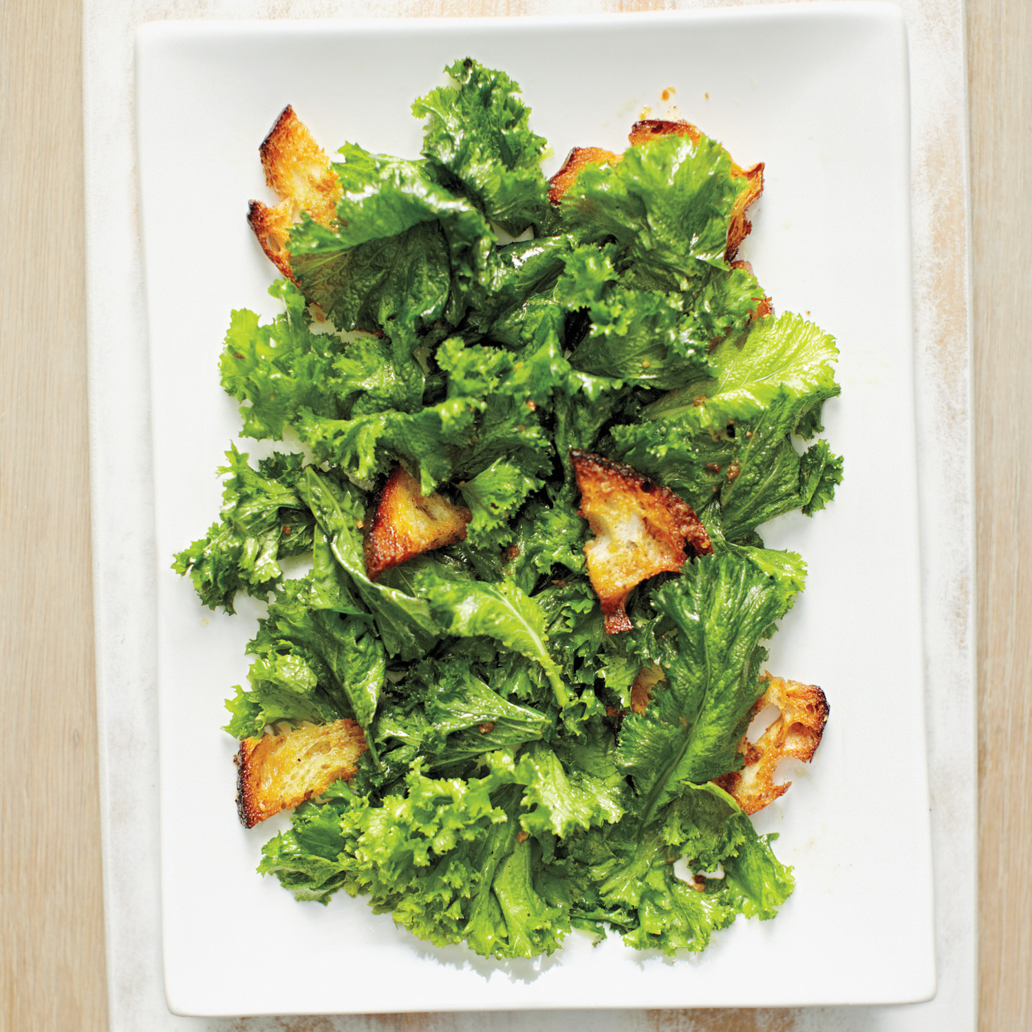 Mustard Greens Salad with Anchovy Croutons