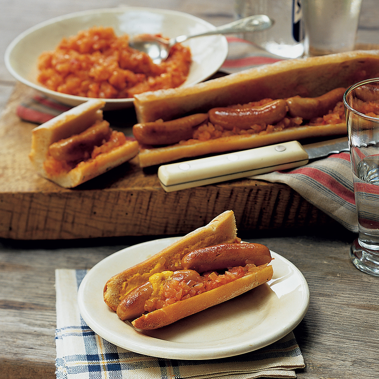 Cocktail Franks in a Baguette with Onion-Tomato Relish