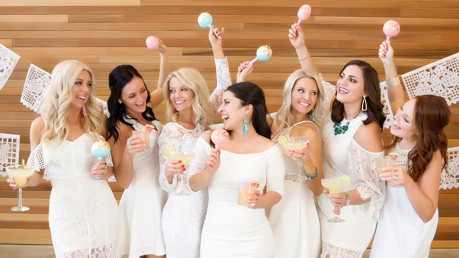 cinco de mayo floral fiesta women celebrating white dresses maracas