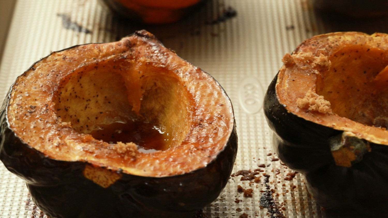 baked acorn squash slices with brown sugar and pecans