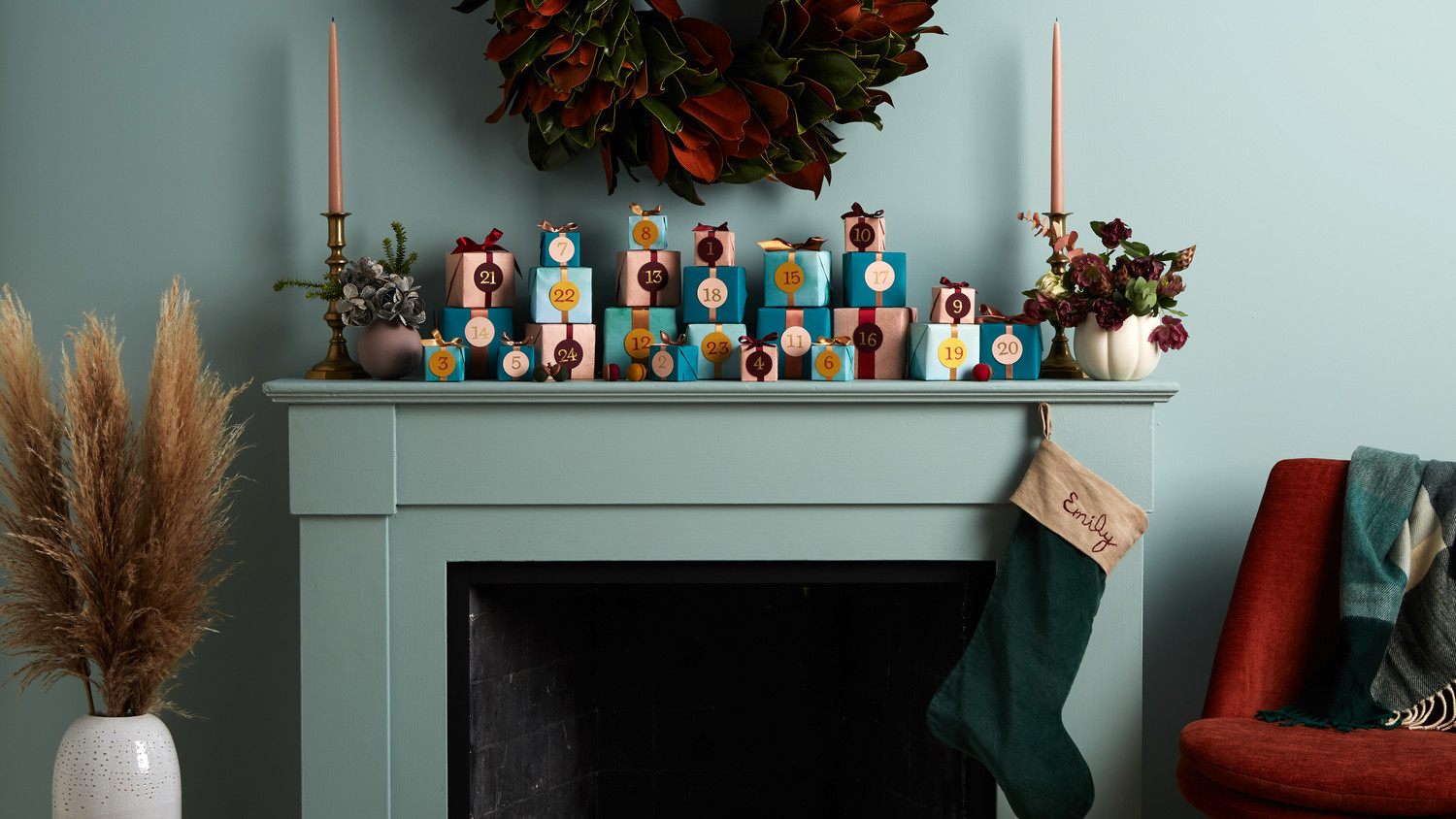 mantle blue wall with advent calendar presents stocking candles wreath