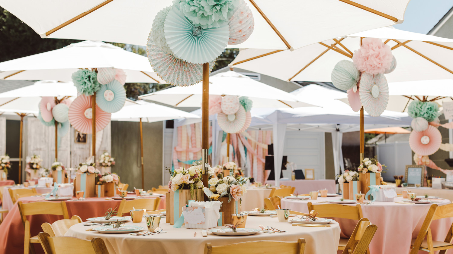 mint blush baby shower decorated space with chairs tables umbrellas