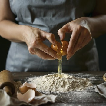 Woman Cracking Eggs, Cooking Making Dough