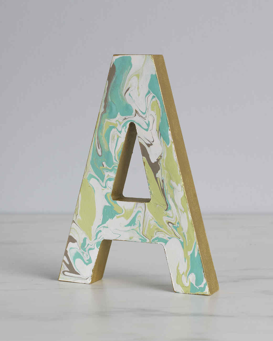 marbleized wooden monogram letter