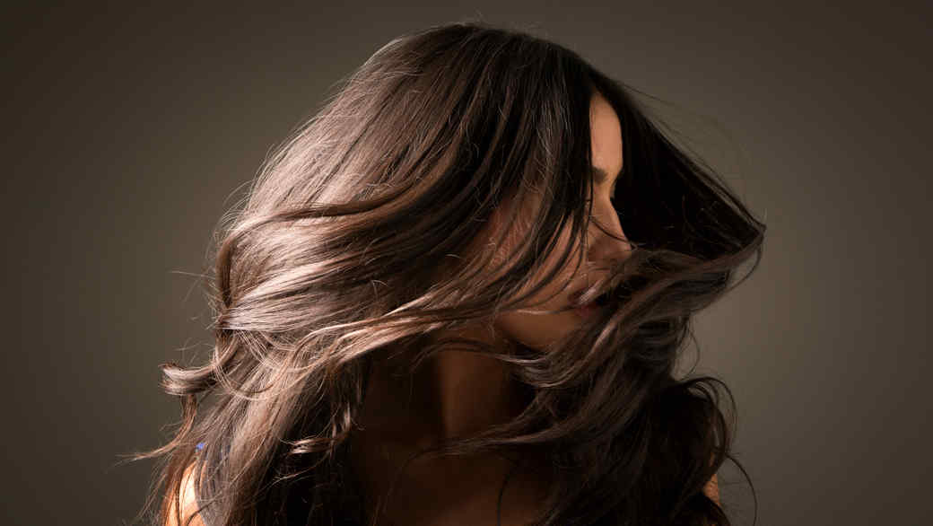 woman tossing shiny hair