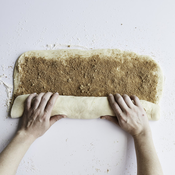 rolling up cinnamon roll dough rolling up cinnamon roll dough