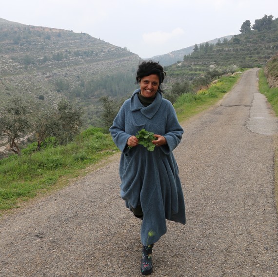 Vivien Sansour, founder of the Palestine Heirloom Seed Library, walks along a mountain pass Vivien Sansour, founder of the Palestine Heirloom Seed Library, walks along a mountain pass
