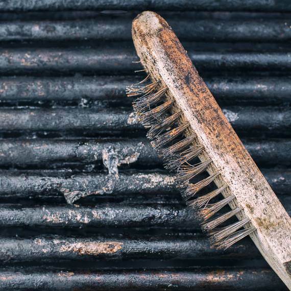 Used Grill Brush With Bristles on Grille Used Grill Brush With Bristles on Grille