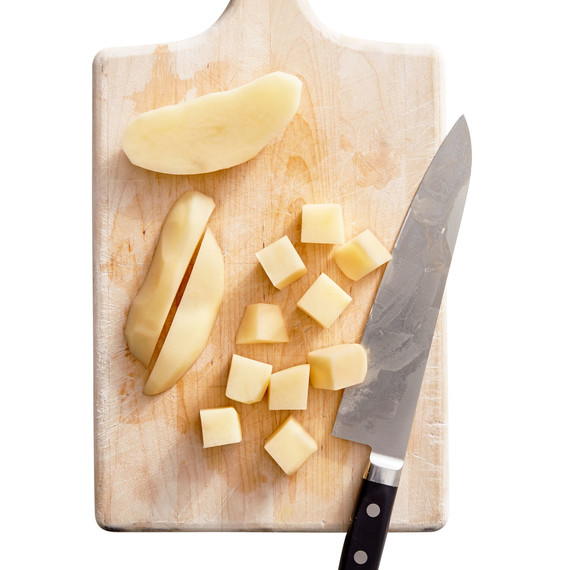 cut-up potatoes on cutting board cut-up potatoes on cutting board