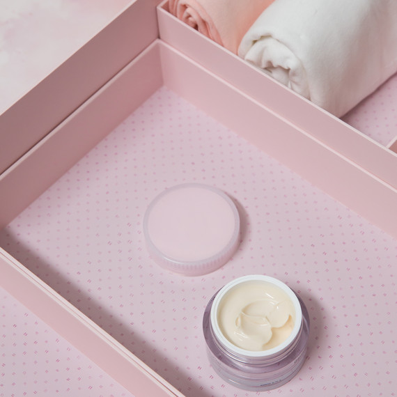 pink marie kondo box holding makeup and rolled clothes pink marie kondo box holding makeup and rolled clothes