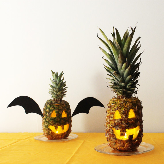 pineapple carved into a jack-o'-lantern pineapple carved into a jack-o'-lantern