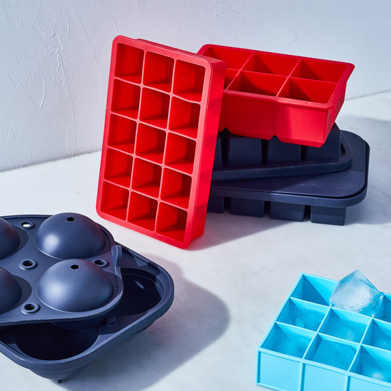 red and blue ice cube trays stacked red and blue ice cube trays stacked