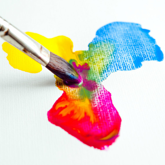 A paintbrush mixing watercolors A paintbrush mixing watercolors