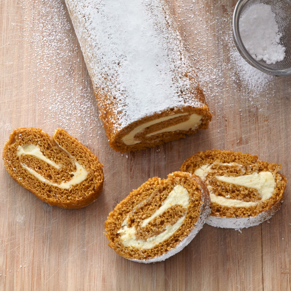 sliced pumpkin roll and sifter with powdered sugar sliced pumpkin roll and sifter with powdered sugar