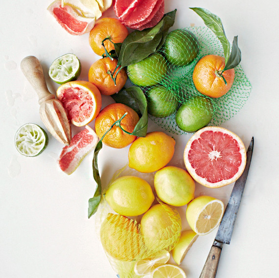 various citrus fruits and knife