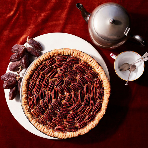 date-nut pie on red table cloth with tea