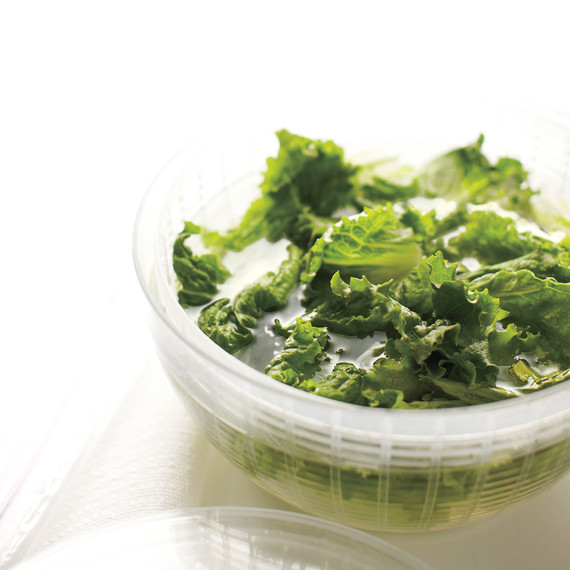 prepping lettuce in bowl prepping lettuce in bowl