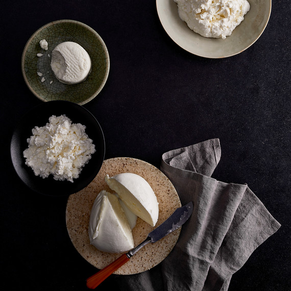 bowls and plate of assorted soft cheese bowls and plate of assorted soft cheese