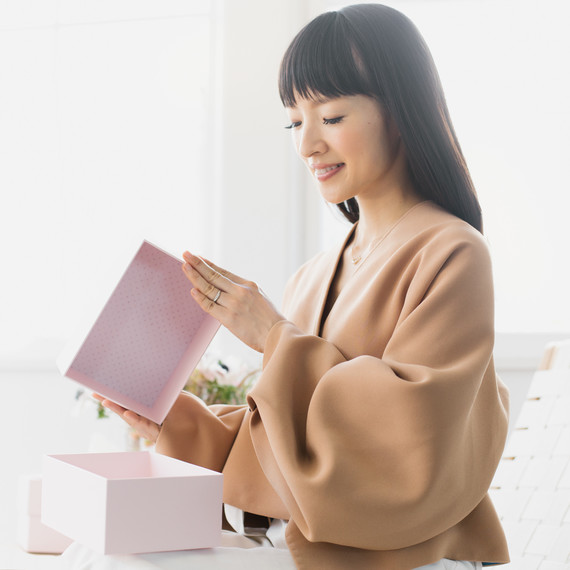 woman opening marie kondo box woman opening marie kondo box