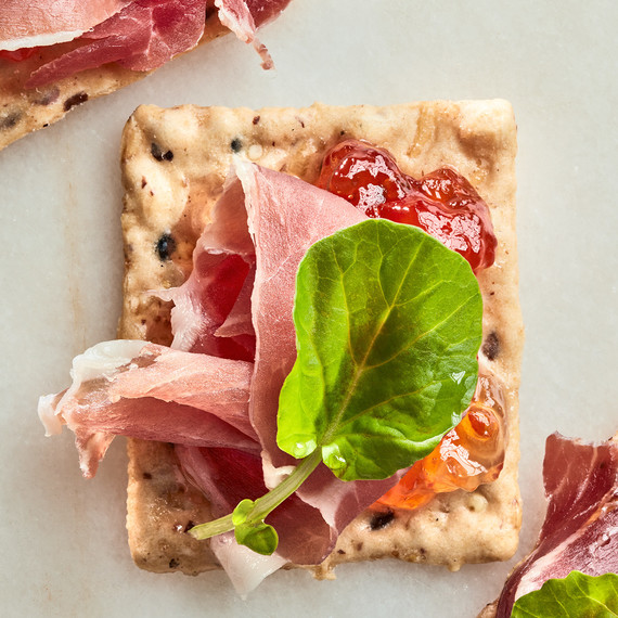 cracker with prosciutto and jelly cracker with prosciutto and jelly