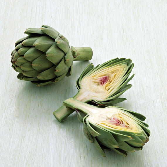 two artichokes one cut in half two artichokes one cut in half