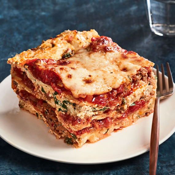 ultimate lasagna slice on plate with fork ultimate lasagna slice on plate with fork