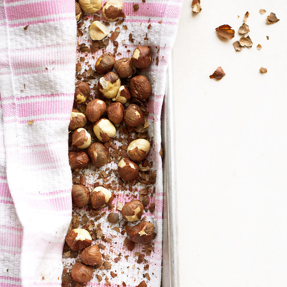 hazelnuts on pan with pink striped cloth hazelnuts on pan with pink striped cloth