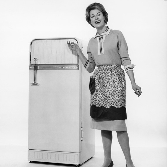 woman posing in front of vintage fridge