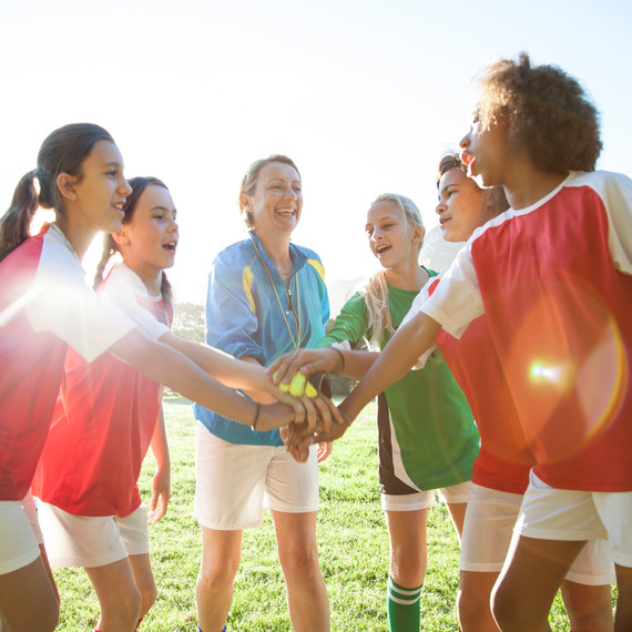 girls teamwork hands in girls teamwork hands in