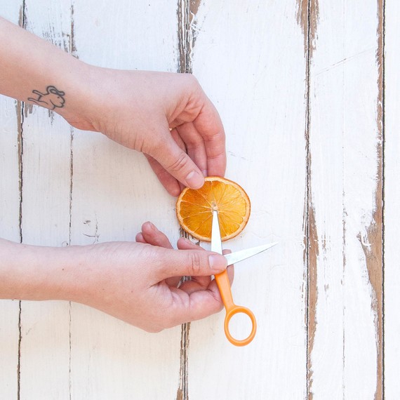 cutting dried orange