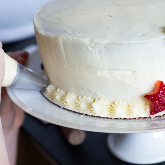 Use a star tip to pipe a border around the cake