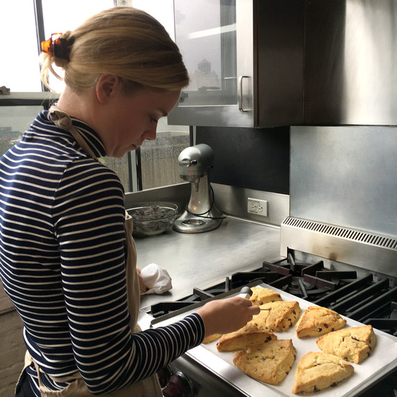 woman preparing scones on baking sheet woman preparing scones on baking sheet