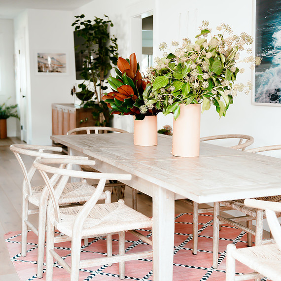 dining table with two vases and coral rug dining table with two vases and coral rug