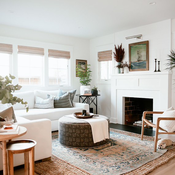 white living room with sectional and wood accents white living room with sectional and wood accents