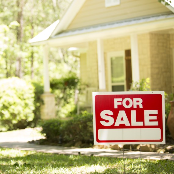 for sale sign in front of house for sale sign in front of house