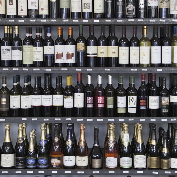 shelves full of wine bottles in wine store shelves full of wine bottles in wine store