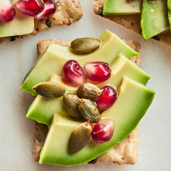 avocado and seeds on crackers avocado and seeds on crackers