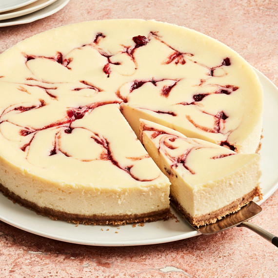 round cranberry cheesecake with slice cut round cranberry cheesecake with slice cut