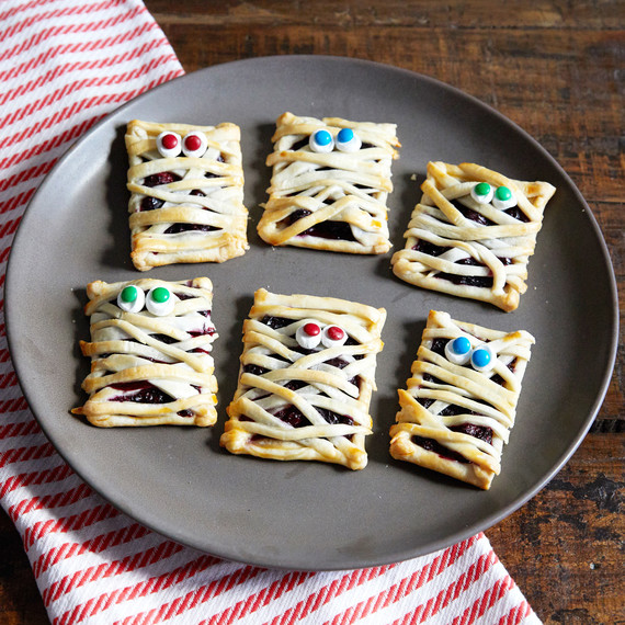 mummy hand pie pastries on gray plate with striped cloth mummy hand pie pastries on gray plate with striped cloth