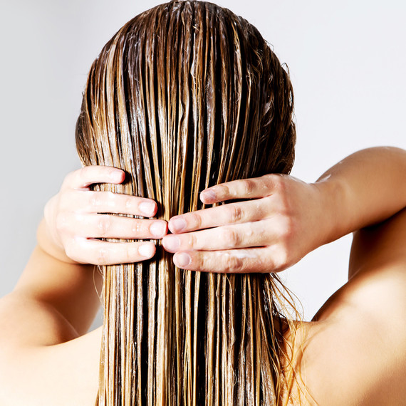 woman rinsing hair getty woman rinsing hair getty