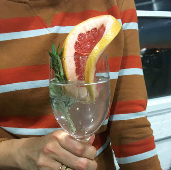 mixed drink with large citrus slice mixed drink with large citrus slice